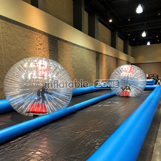 Introducing our thrilling "2 Lane Slide Inflatable Race Track"! Perfect for zorb ball racing or go-karting, this track guarantees adrenaline-packed fun. With two lanes, it's ideal for competitive races and exciting challenges. Crafted from durable materials, it ensures safety and durability for hours of enjoyment. Bring the excitement of the track to your backyard or event with this inflatable race track!