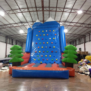 Scale new heights of excitement with our Amusement Park Inflatable Rock Climbing Wall! Perfect for sports games, this straight inflatable climb wall offers a thrilling challenge amidst pine trees. Test your agility and conquer the wall for an exhilarating adventure. Get ready to reach the top and feel the rush of victory!