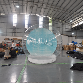 Celebrate the season in style with our Christmas Human Size Inflatable Snow Globe! Perfect for holiday parties and events, this life-sized snow globe doubles as a bounce house, offering festive fun for all. Step inside and create magical memories amidst the swirling snow. Make your Christmas unforgettable with our inflatable snow globe bounce house!