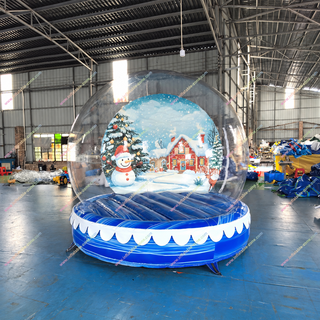 Transform your holiday party into a winter wonderland with our Inflatable Snow Dome! Perfect for Christmas events, this bubble-style bounce house brings festive fun for all ages. Step inside for a snow globe experience, ideal for photos, bouncing, and unforgettable holiday activities near you.