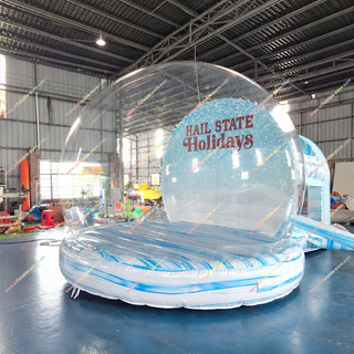 Turn holiday celebrations into a winter wonderland with a Large Inflatable Snow Globe featuring a clear bubble design, transparent walls, bounce house, and photo booth area. Perfect for Christmas parties, winter festivals, holiday markets, family gatherings, and rental businesses, it provides festive entertainment and creative photo opportunities. Add a unique seasonal attraction that delights guests and makes every event memorable.