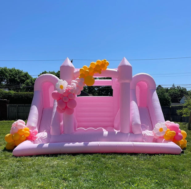 Pastel pink inflatable bouncy castle with slide and ball pit combo for wedding parties