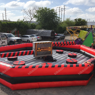 Prepare for an adrenaline-fueled adventure with our Red Interactive Toxic Meltdown Inflatable Ride! This challenging wipeout game boasts mechanical hurdles to conquer. Get set to duck, leap, and twist your way through this heart-pumping attraction, guaranteed to thrill all participants!