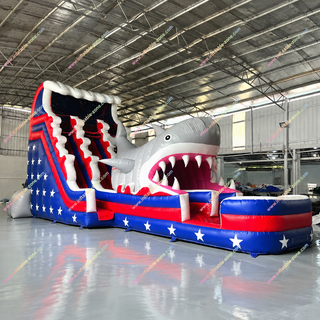 Dive into summer fun with the Shark Inflatable Water Slide! This large slip n slide features a bold shark design paired with patriotic American flag and stars graphics. Perfect for pool parties, backyard fun, and holiday celebrations—rent this exciting inflatable water slide near you today!