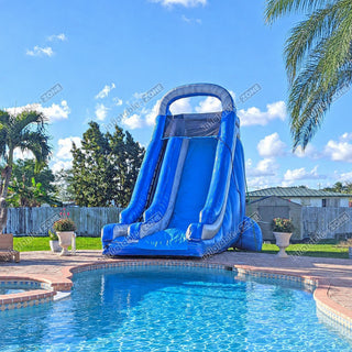 Commercial blue inflatable water slide beside a swimming pool natural color