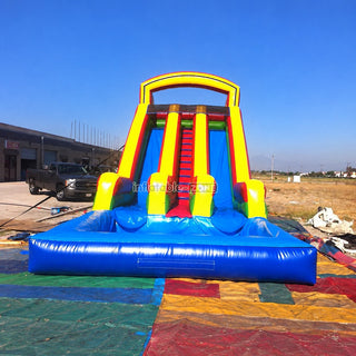 Colorful commercial inflatable double water slide outdoors
