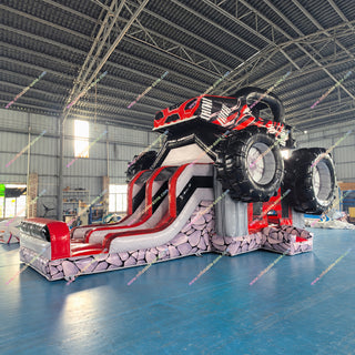 Monster truck inflatable bounce house with dual slides in a factory - centered square