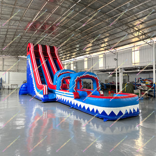 Red blue and white inflatable slip and slide water slide in a factory